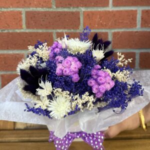 Dried Floral Arrangement in White Ceramic Vase - Image 2